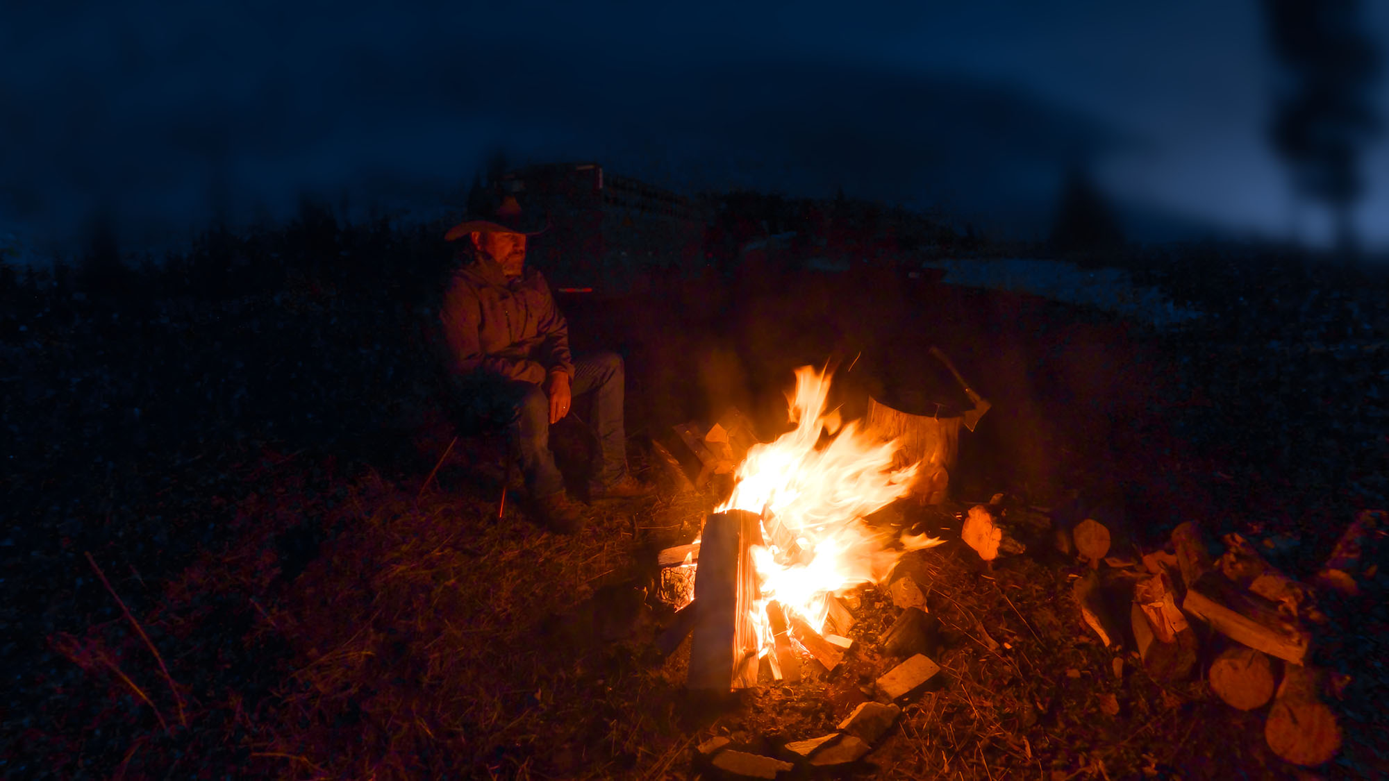 Campfire at night in the mountains
